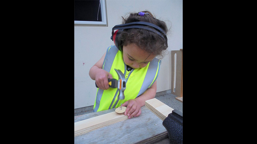 Child doing carpentry at Learning Adventures Levin childcare