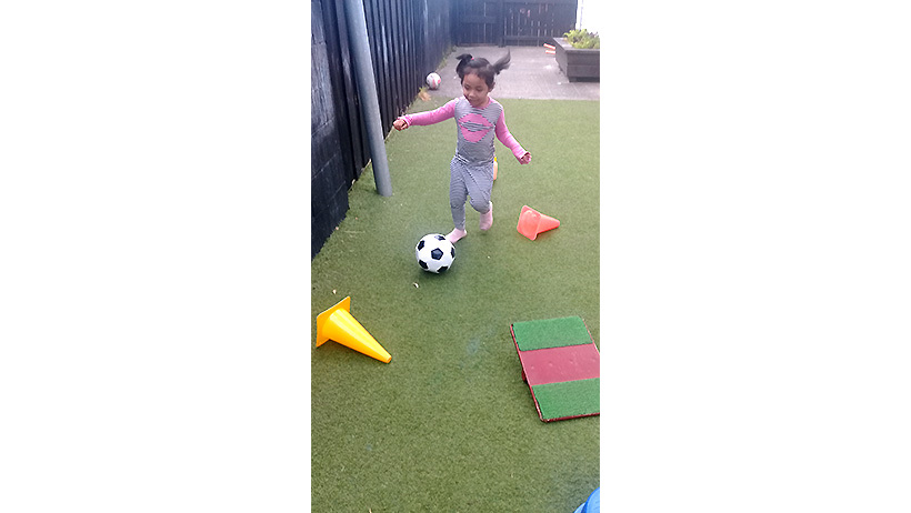 Children playing with balls at Learning Adventures Mangere East daycare